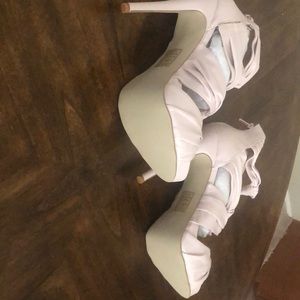 Never worn simulated leather heels.